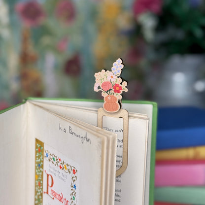 Floral bookmark on a book with a blurred floral background